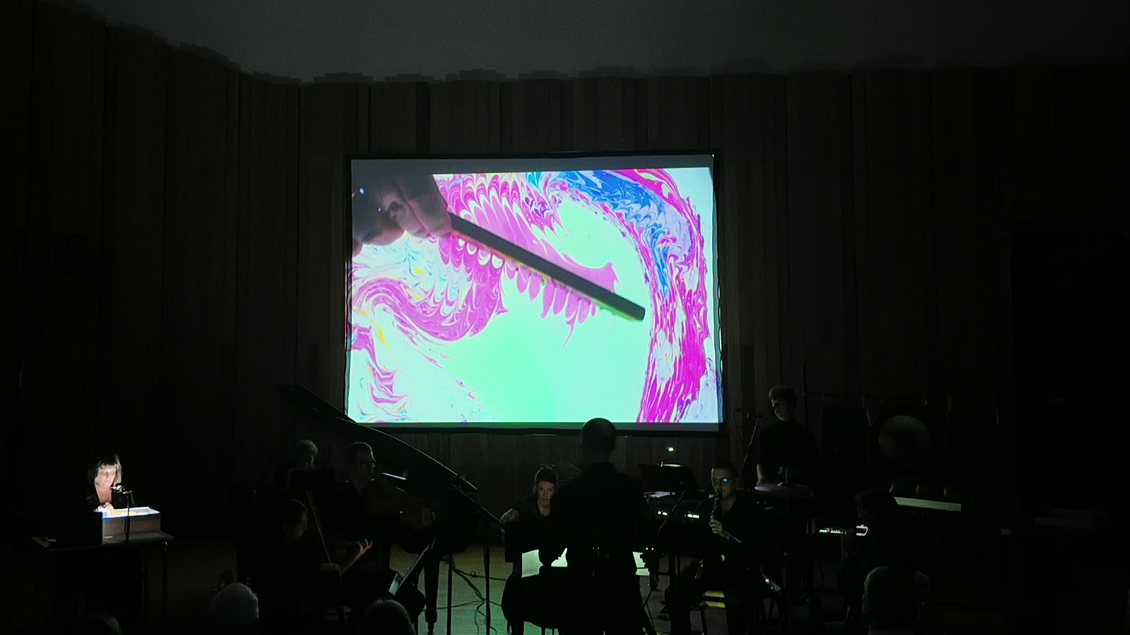 a needle pulls magenta pigment across the projected tray