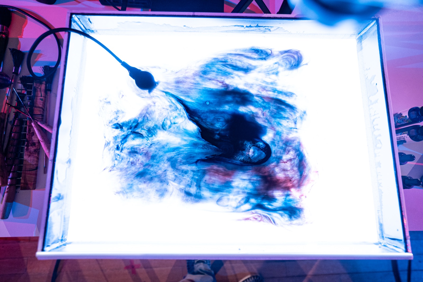 the ebru tray from above, lit from below, contact microphone in the water