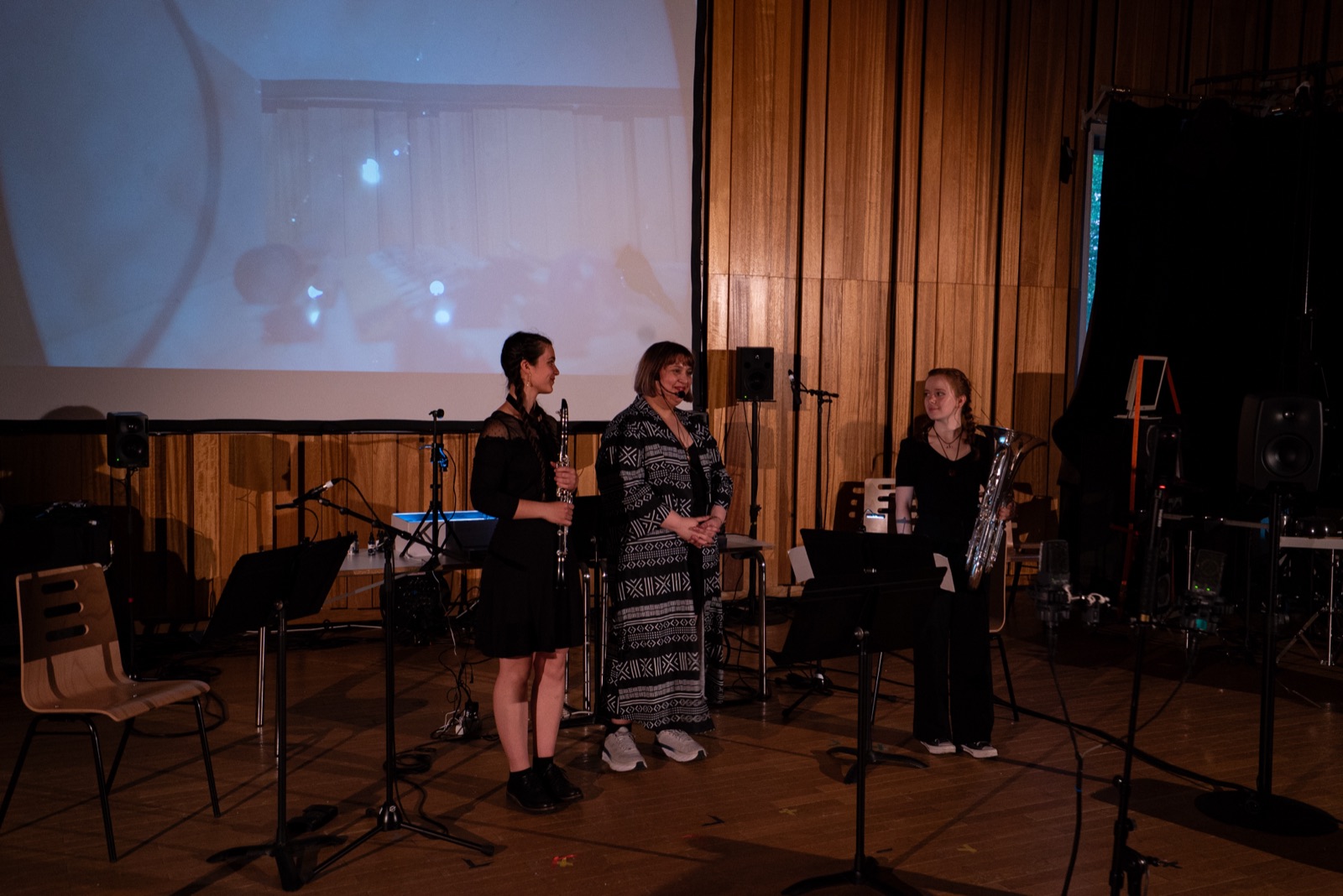 the three performers standing after the performance